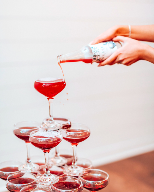 Sparkling tea being poured into a champagne tower